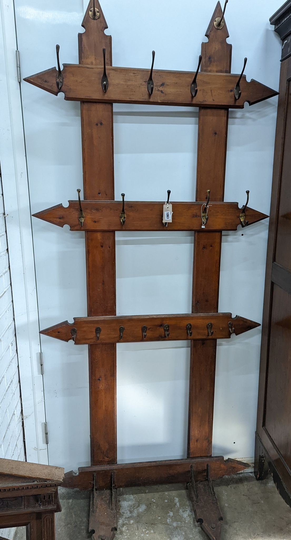 A late Victorian pitch pine hall stand, width 98cm, height 240cm